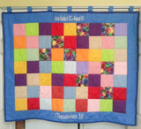 A quilt wall hanging for an organization